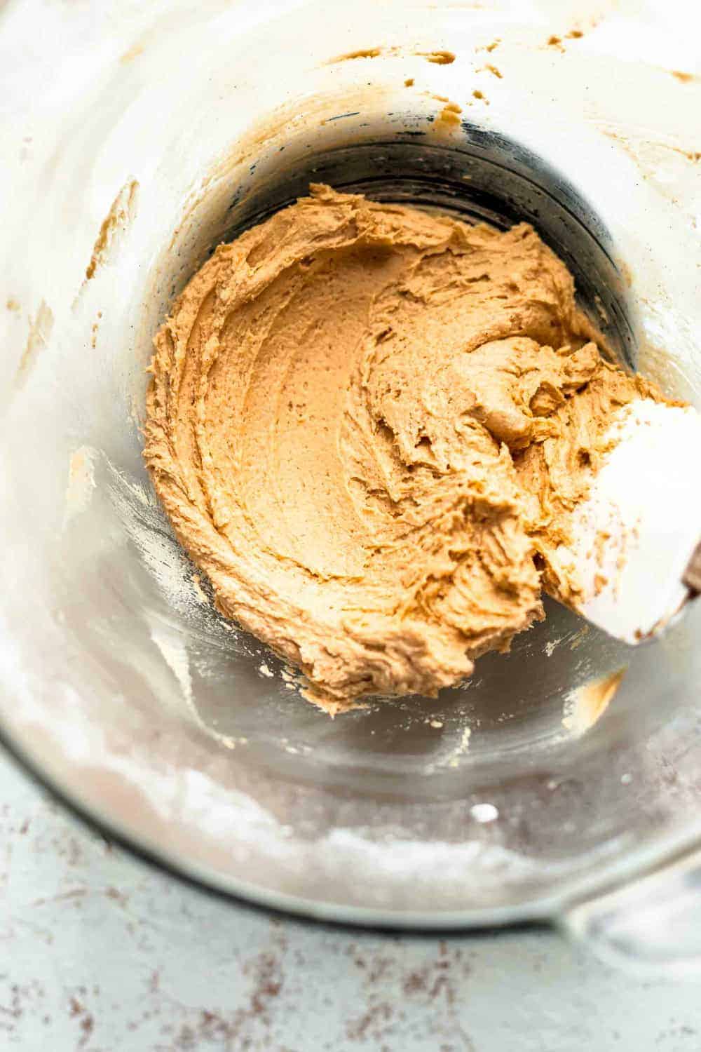 Peanut butter filling in a glass bowl with a white spatula