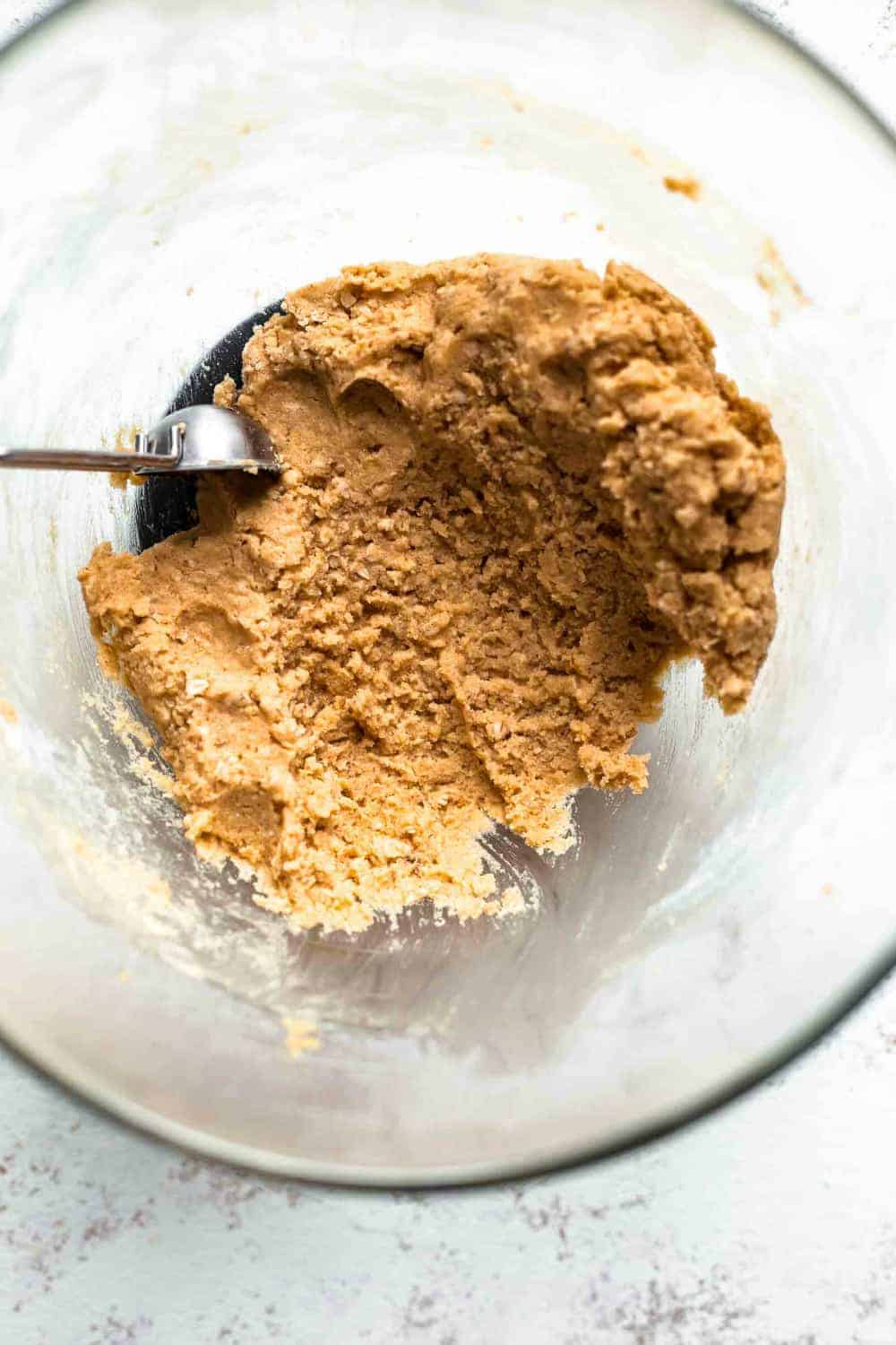 Peanut butter cookie dough in a glass bowl