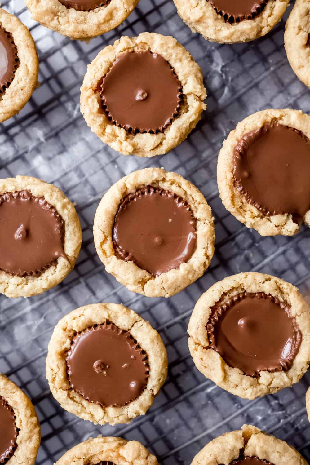 Close-up overhead view of Peanut Butter Cup Cookies on a cooling rack