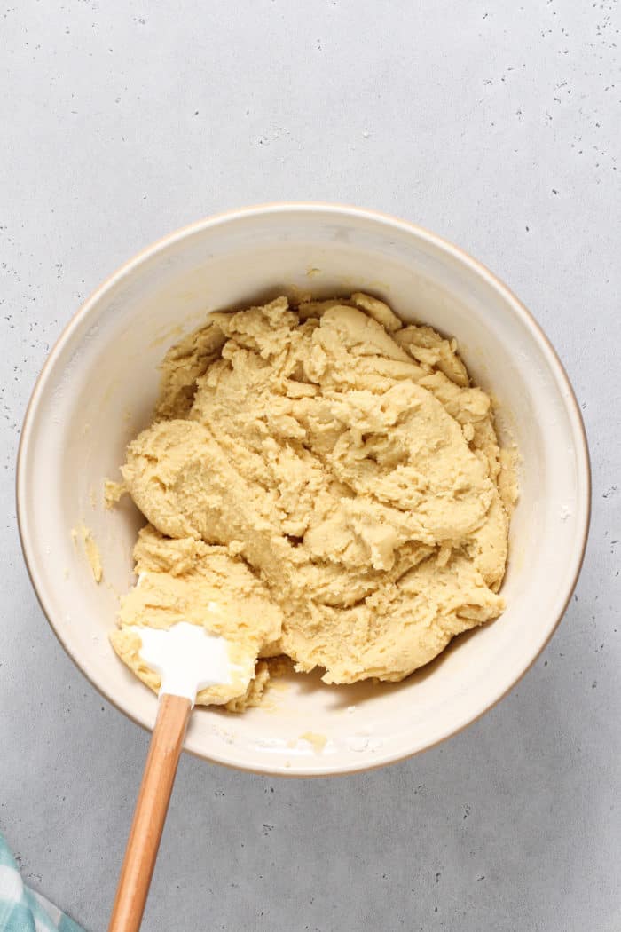 Sugar cookie bar dough in a ceramic mixing bowl