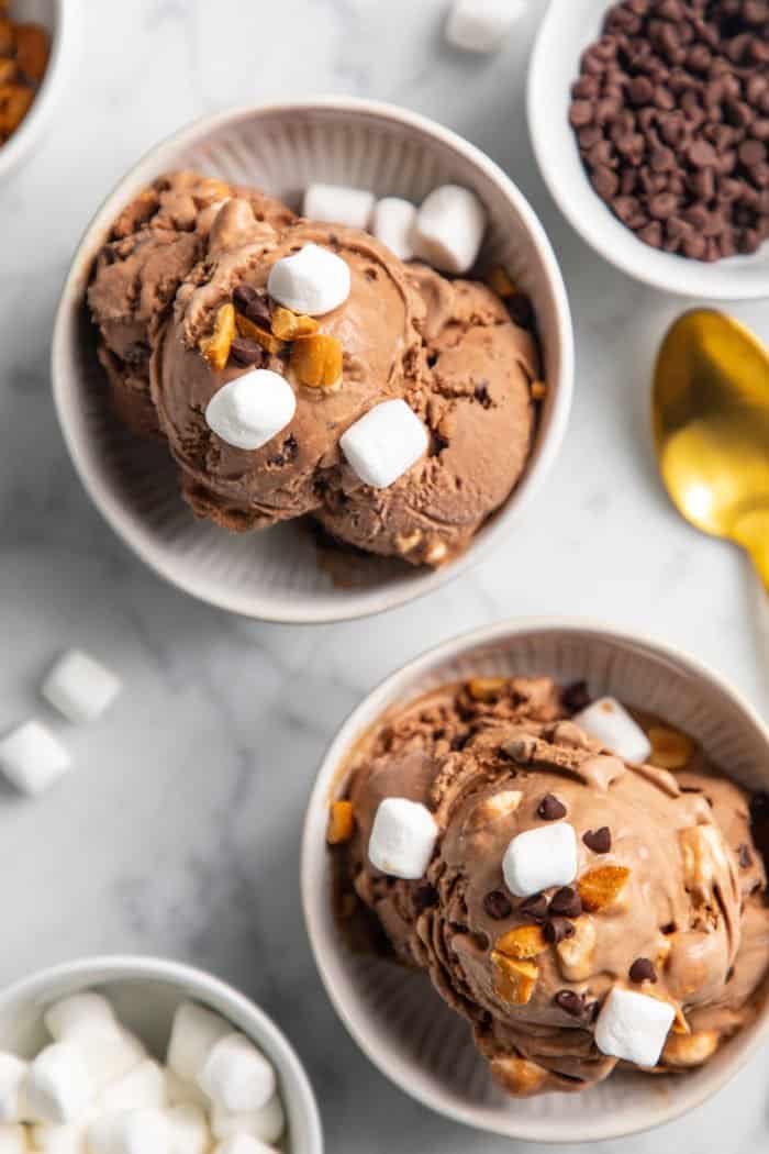 Two white bowls filled with rocky road ice cream.