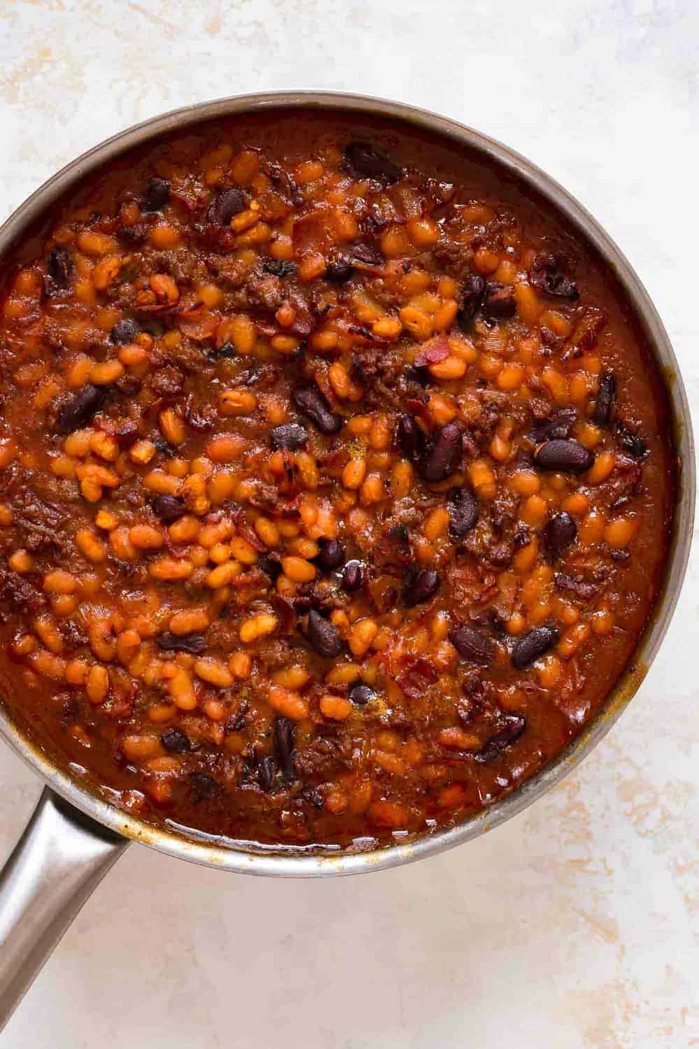 Skillet of old fashioned baked beans fresh from the oven