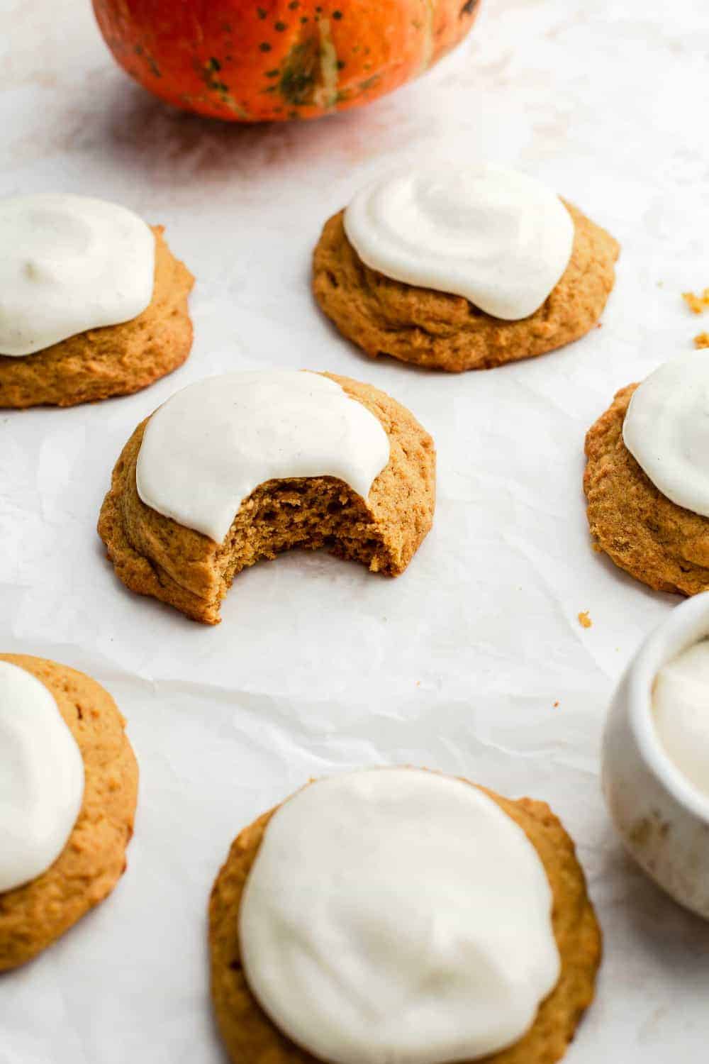 Pumpkin cookies topped with tangy cream cheese frosting