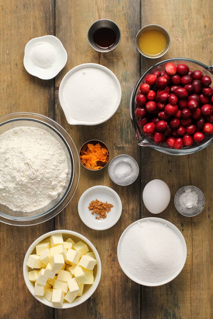 Ingredients for cranberry crumb bars arranged on a wooden table