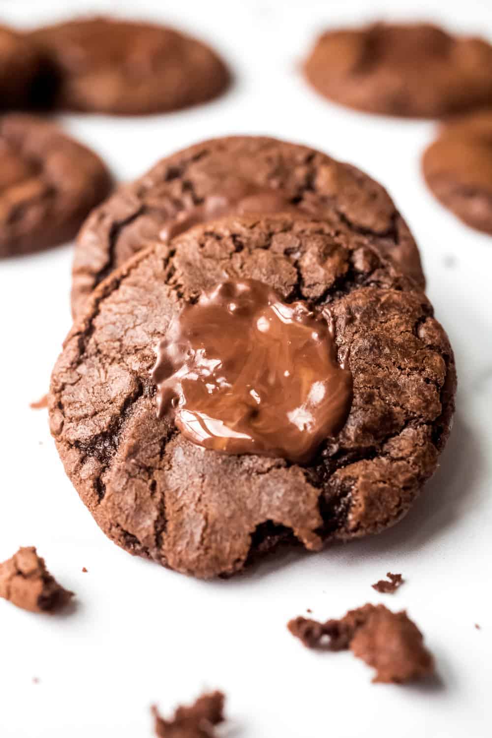 Close up of a mint chocolate cookie with melted mint chocolate candy on top