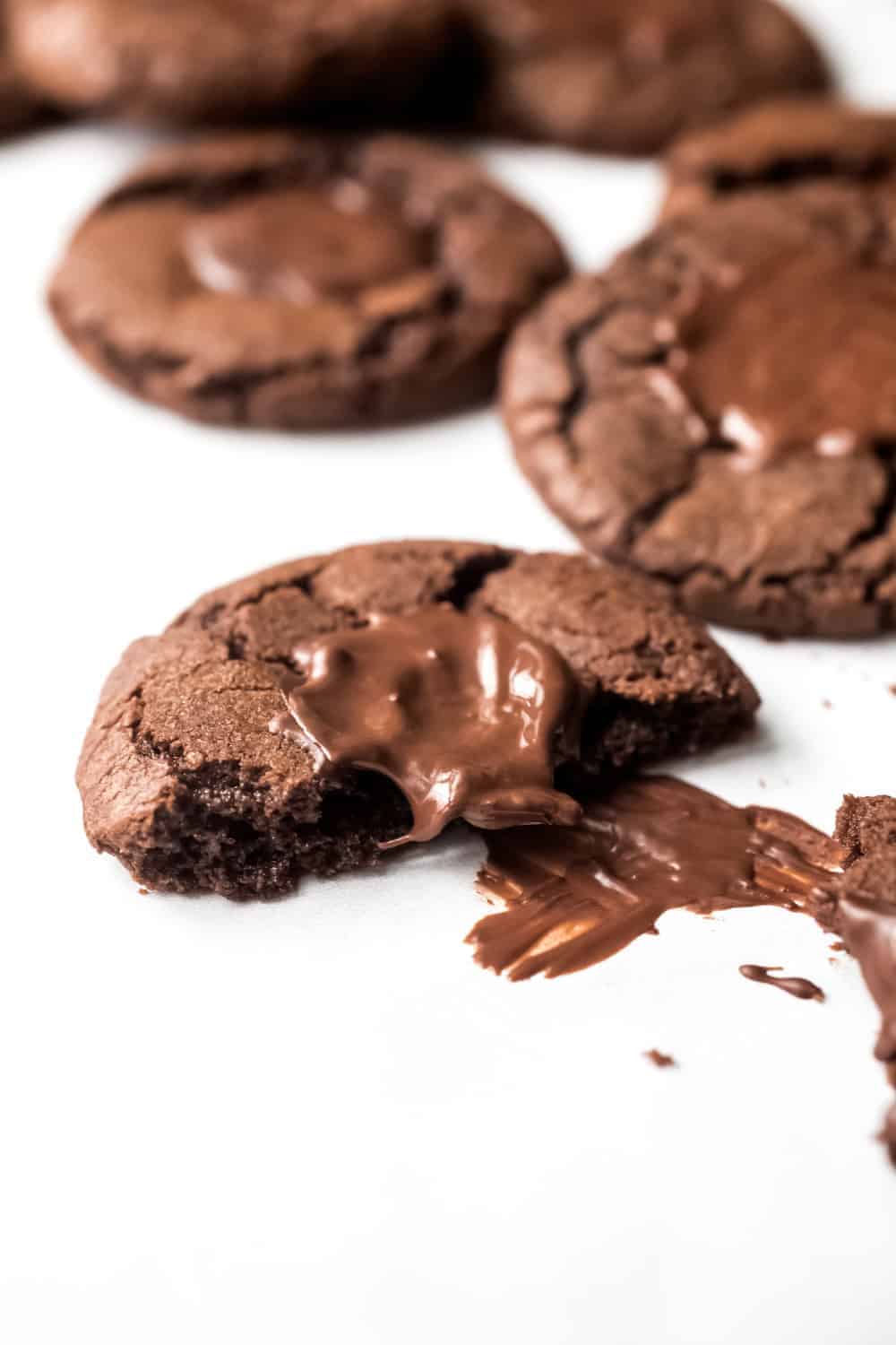 Mint chocolate cookie broken in half, showing the melty mint chocolate wafer candy on top