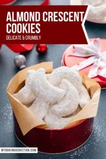 Almond crescent cookies arranged in a red tin. Text overlay includes recipe name.