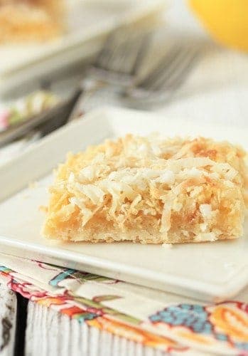 Close up of a lemon coconut bar on a plate