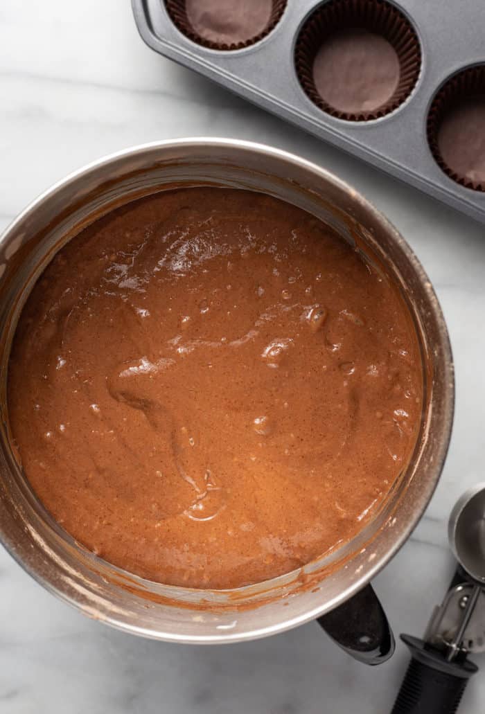 Batter for guinness cupcakes in a metal mixing bowl