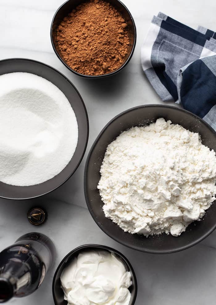 Dry ingredients for guinness cupcakes arranged on a marble counter