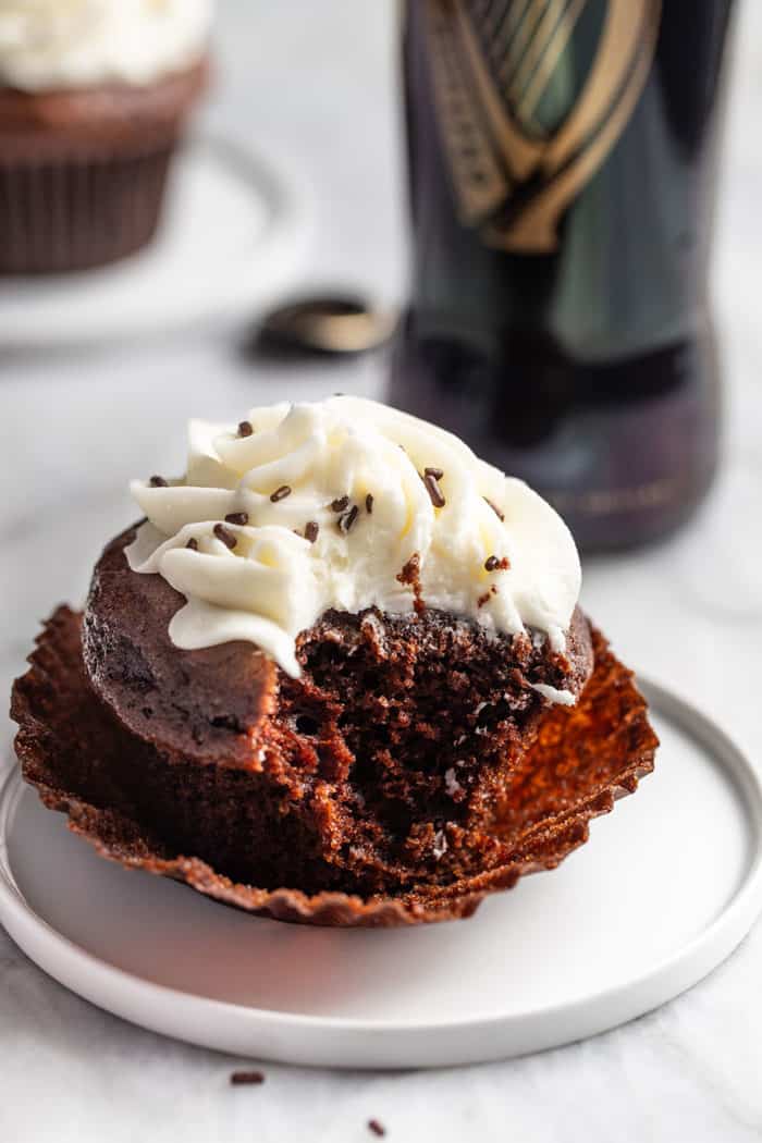 Plated Guinness Cupcake with a bite taken out of it
