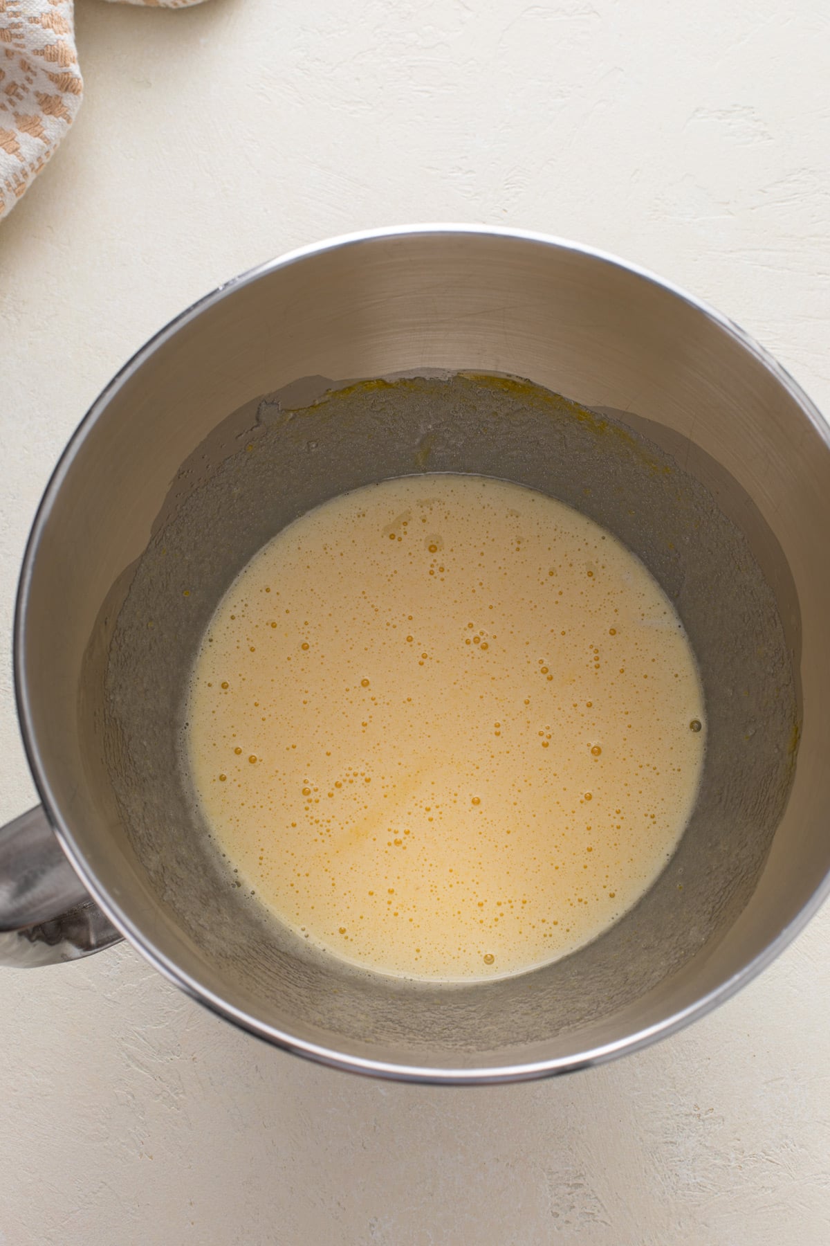 Eggs and sugar beaten in a bowl until pale in color.