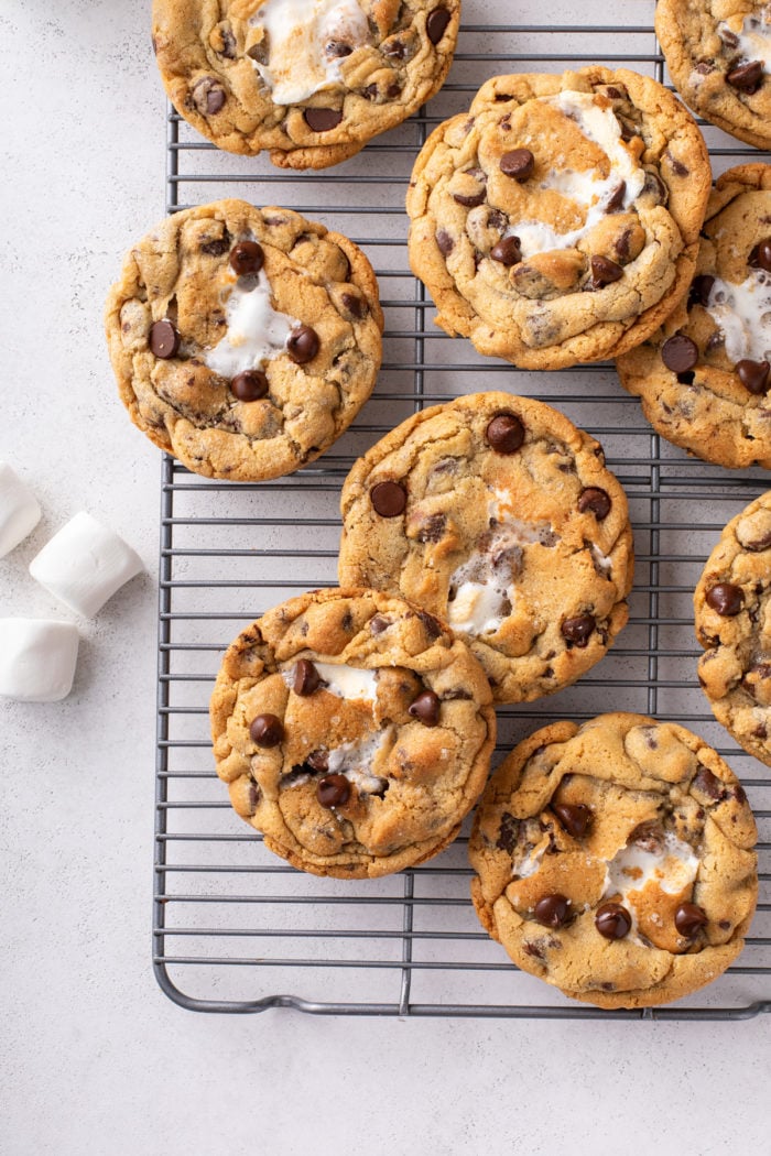 Giant s'mores cookies cooling on a wire rack.