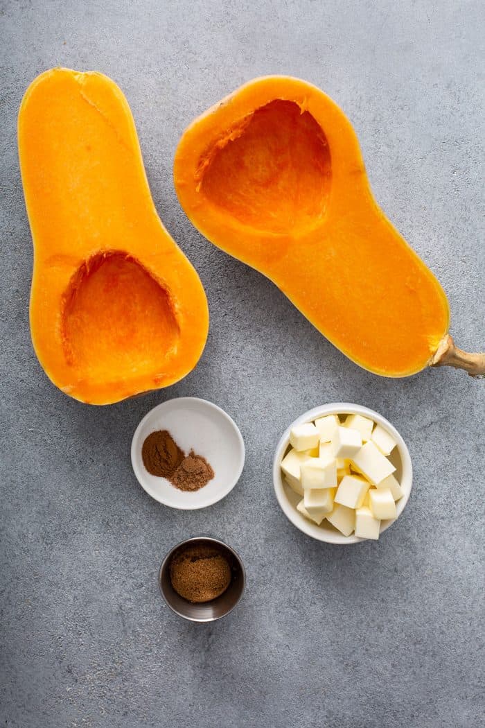 Overhead view of ingredients for butternut squash puree on a gray counter