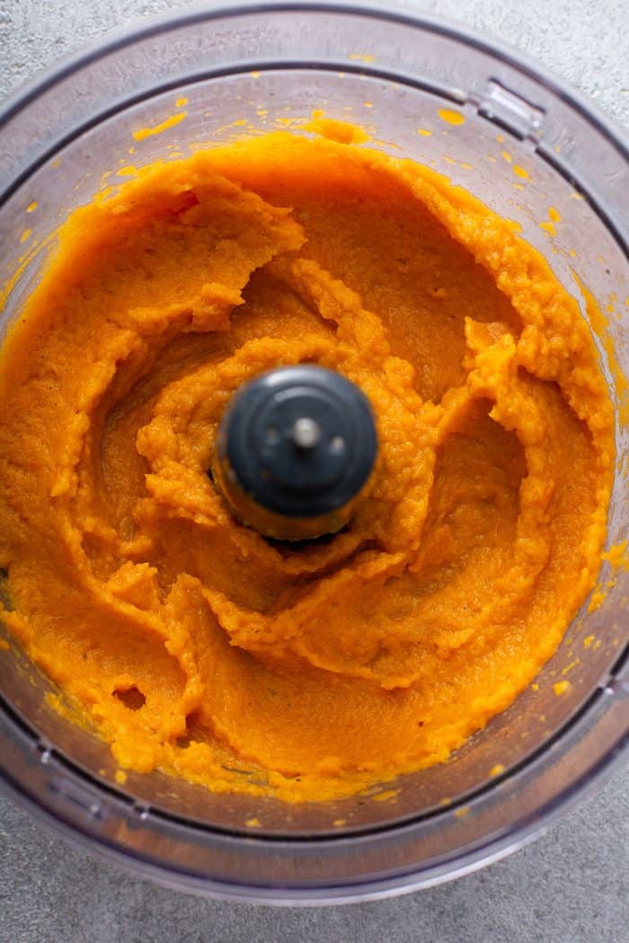 Butternut squash in a food processor bowl after being pureed