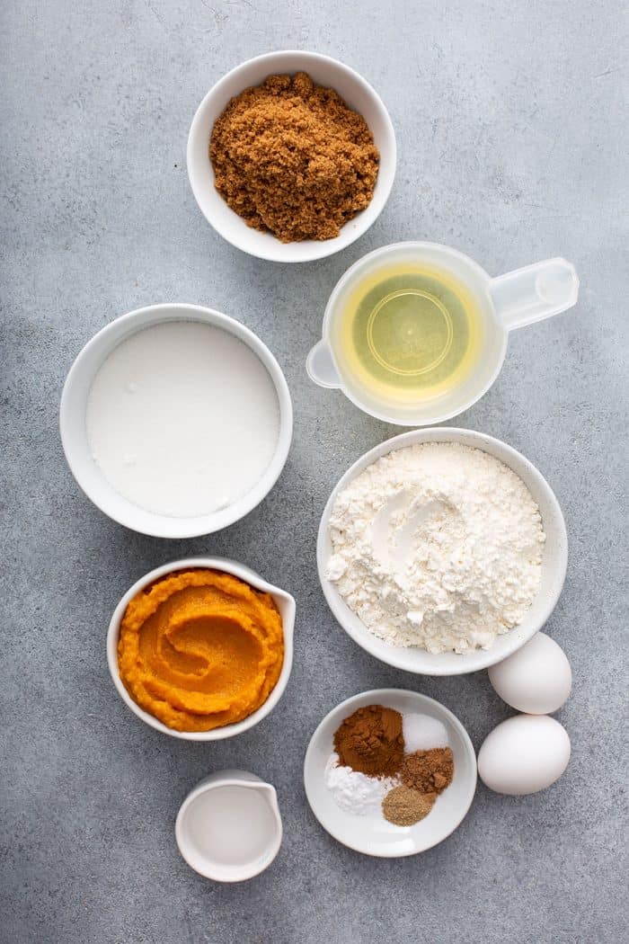 Overhead view of ingredients for butternut squash bread on a gray countertop