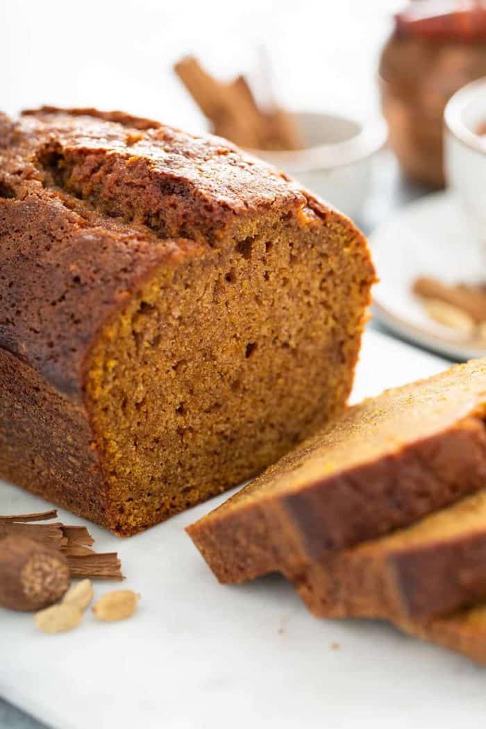 Sliced loaf of butternut squash bread on a cutting board