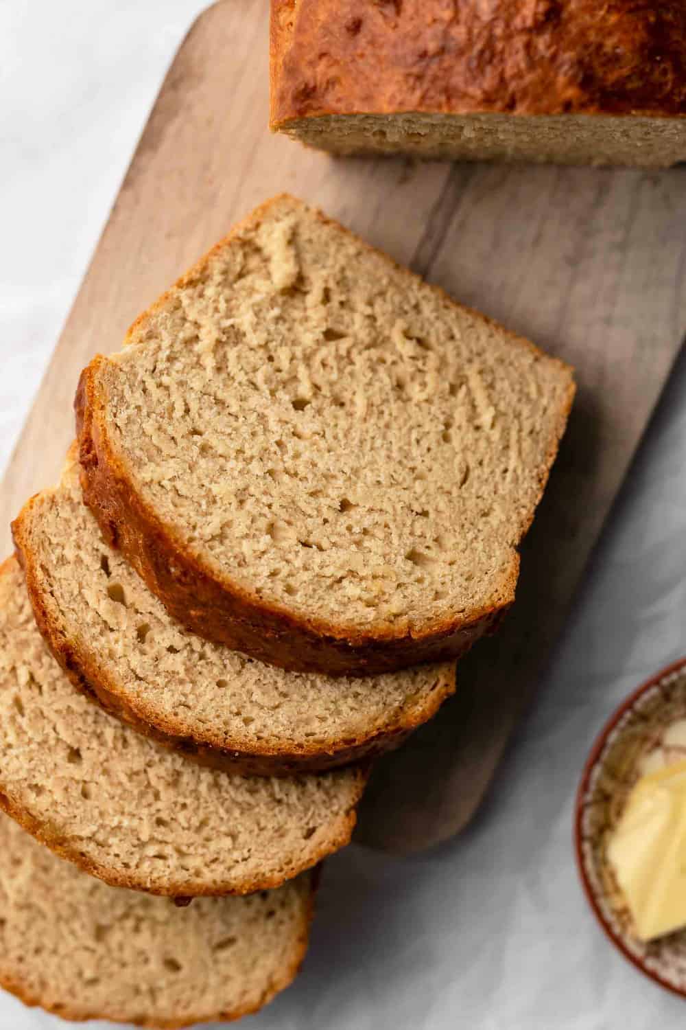 Slices of beer bread on a wooden cutting board