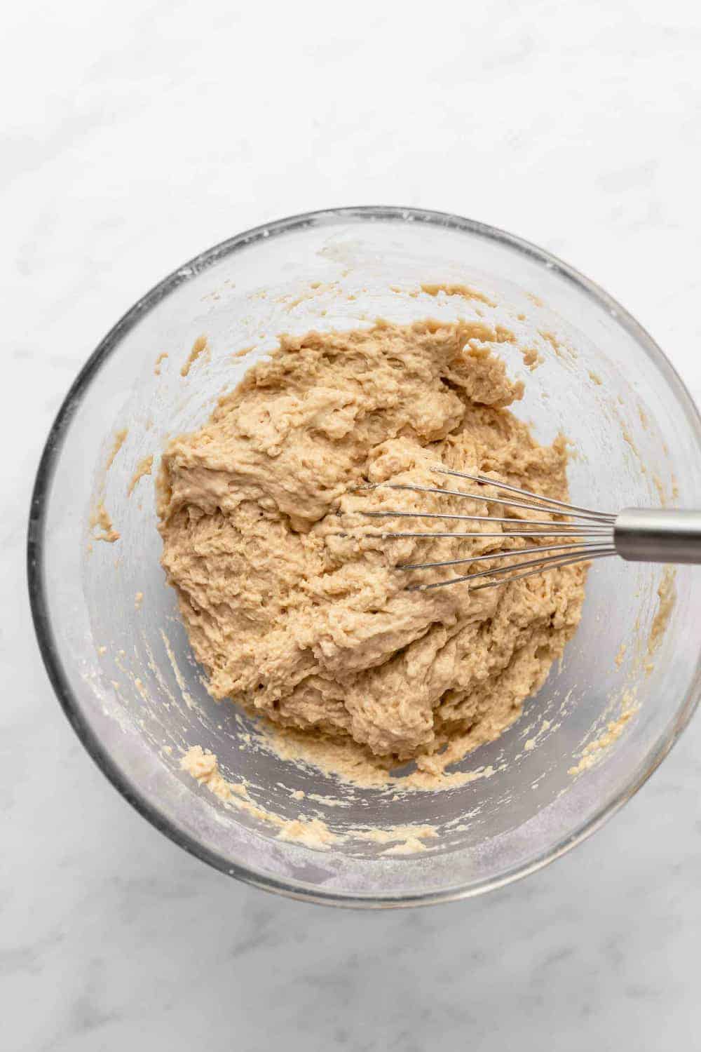 Batter for beer bread in a glass mixing bowl