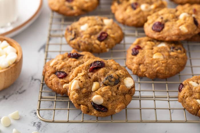 Pumpkin oatmeal cookies cooling on a wire rack on a marble countertop