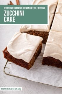 Corner slice pulled away from a zucchini cake topped with maple cream cheese frosting. Text overlay includes recipe name.