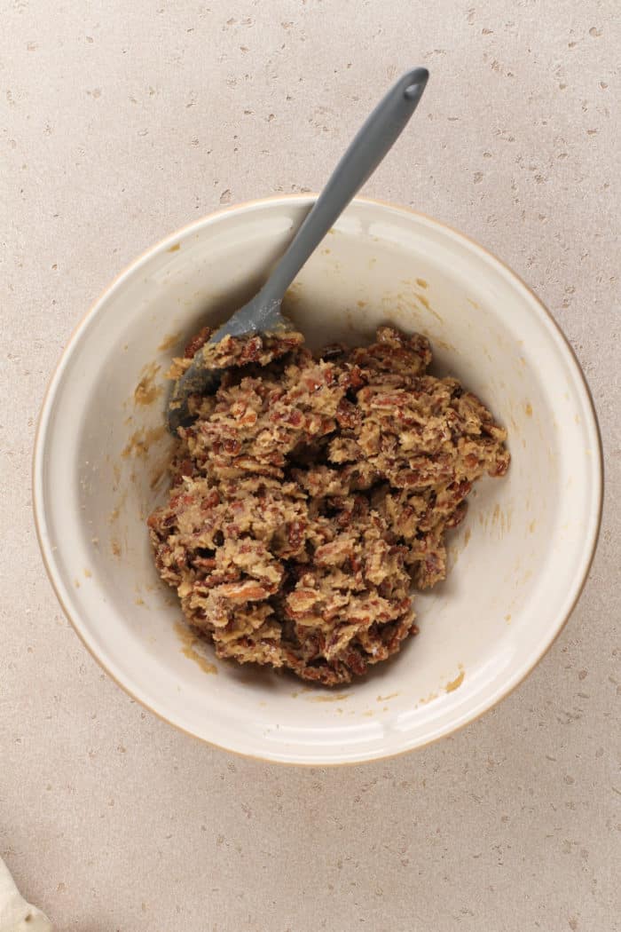 Pecan bar filling in a ceramic mixing bowl.