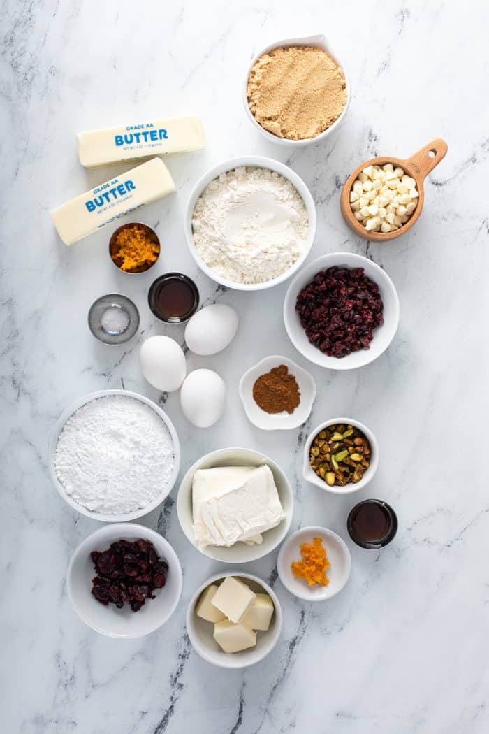 Ingredients for cranberry bliss bars arranged on a marble countertop