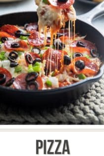 Hand dipping into a skillet of baked pizza dip with a crostini. Text overlay includes recipe name.