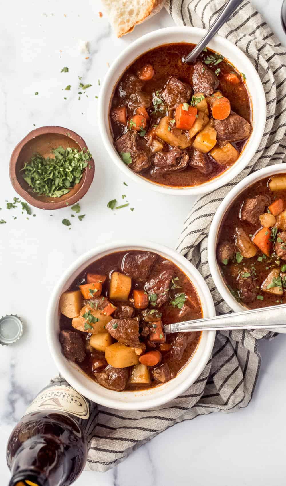 Bowls of Guinness beef stew on a white counter