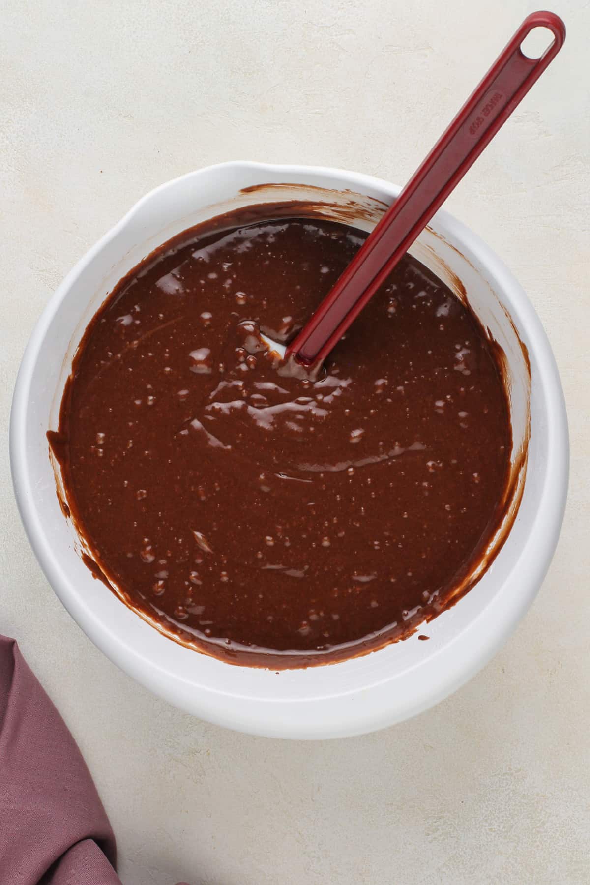 Chocolate guinness cake batter in a large white bowl.