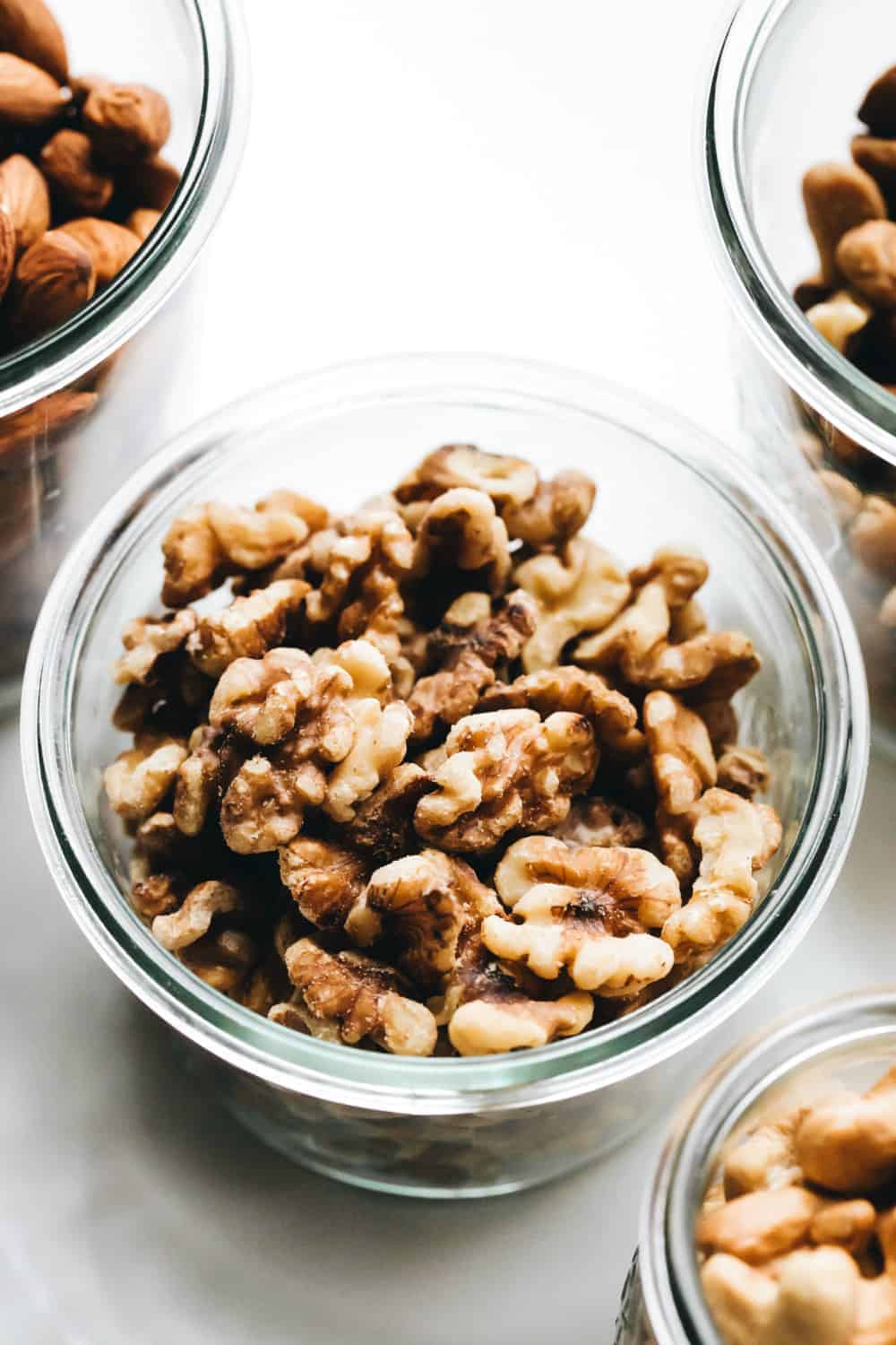 Toasted walnuts in a glass jar