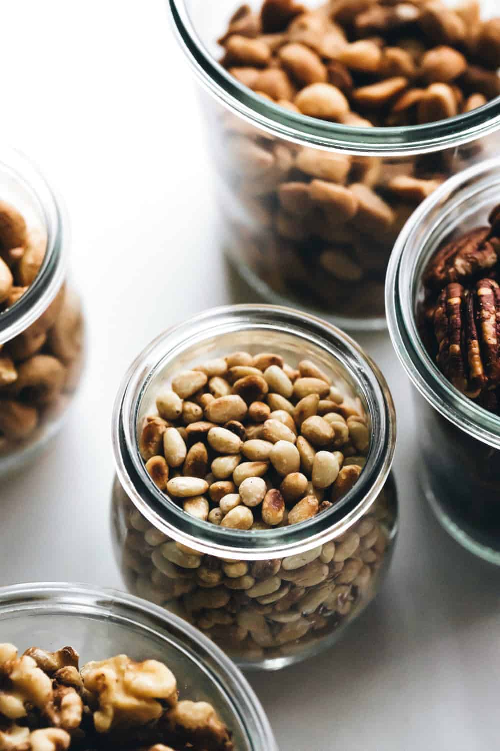 Toasted pine nuts in a glass jar