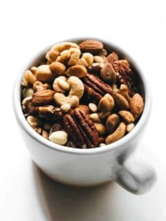 Mixed nuts in a white coffee cup