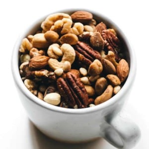 Mixed nuts in a white coffee cup