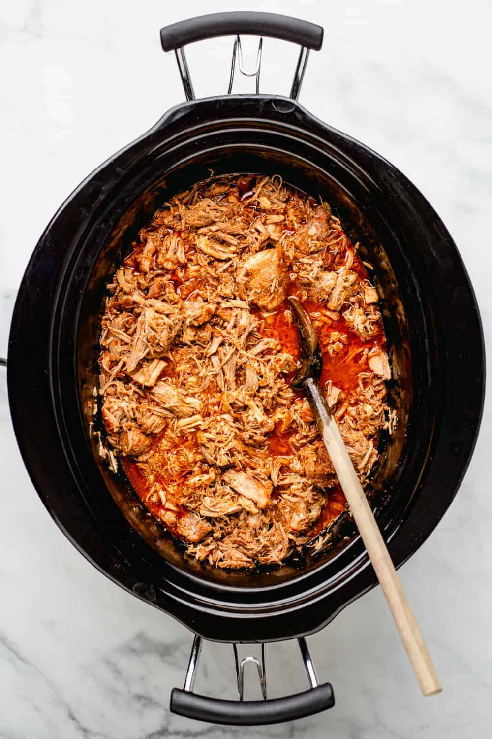 Easy Crockpot Pulled Pork spends the day slow cooking in a tangy cider vinegar sauce for pulled pork that is not only tender and flavorful, it’s as easy as can be.