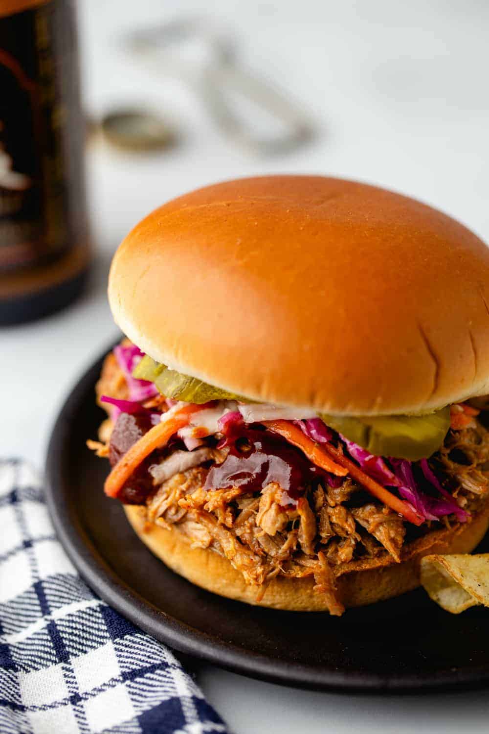 Easy Crockpot Pulled Pork cooks all day in a tangy vinegar sauce for the most tender, flavorful pork.