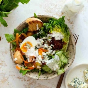 Homemade blue cheese dressing on a mixed greens salad