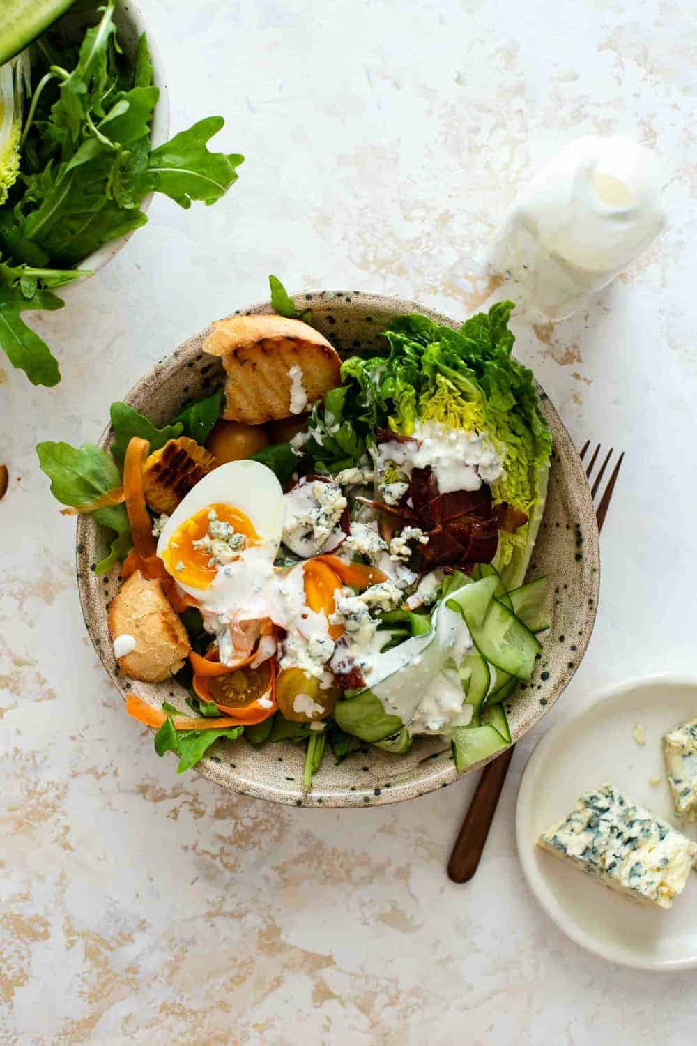 Homemade blue cheese dressing on a mixed greens salad