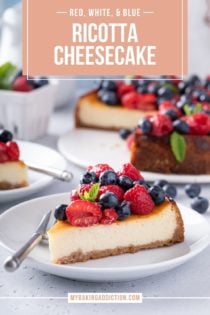 White plate with a slice of ricotta cheesecake that is topped with rows of raspberries and blueberries. Text overlay includes recipe name.