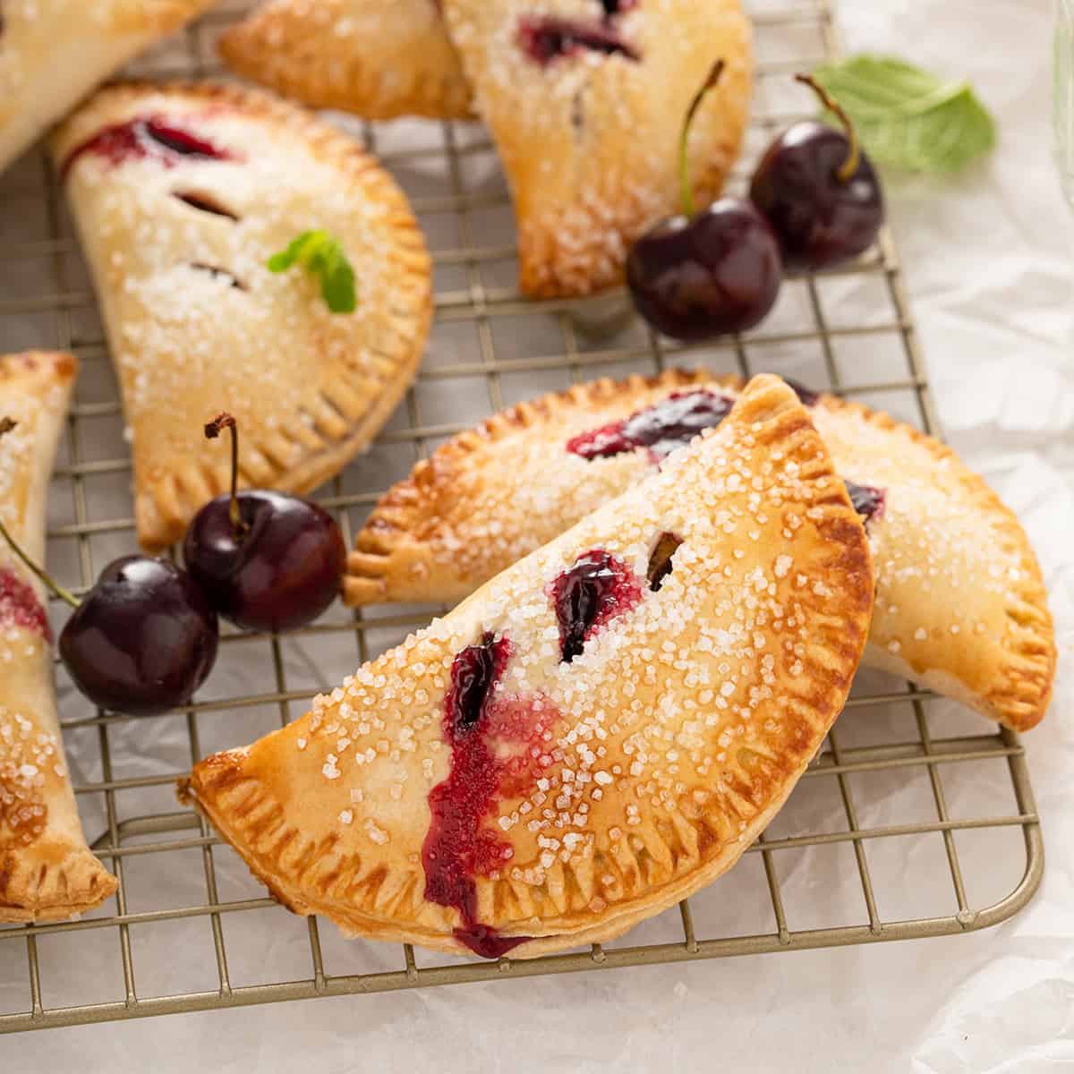 https://www.mybakingaddiction.com/wp-content/uploads/2011/07/cooling-cherry-hand-pies-hero.jpg