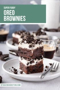 White plate holding a fork and two stacked oreo brownies. Text overlay includes recipe name.