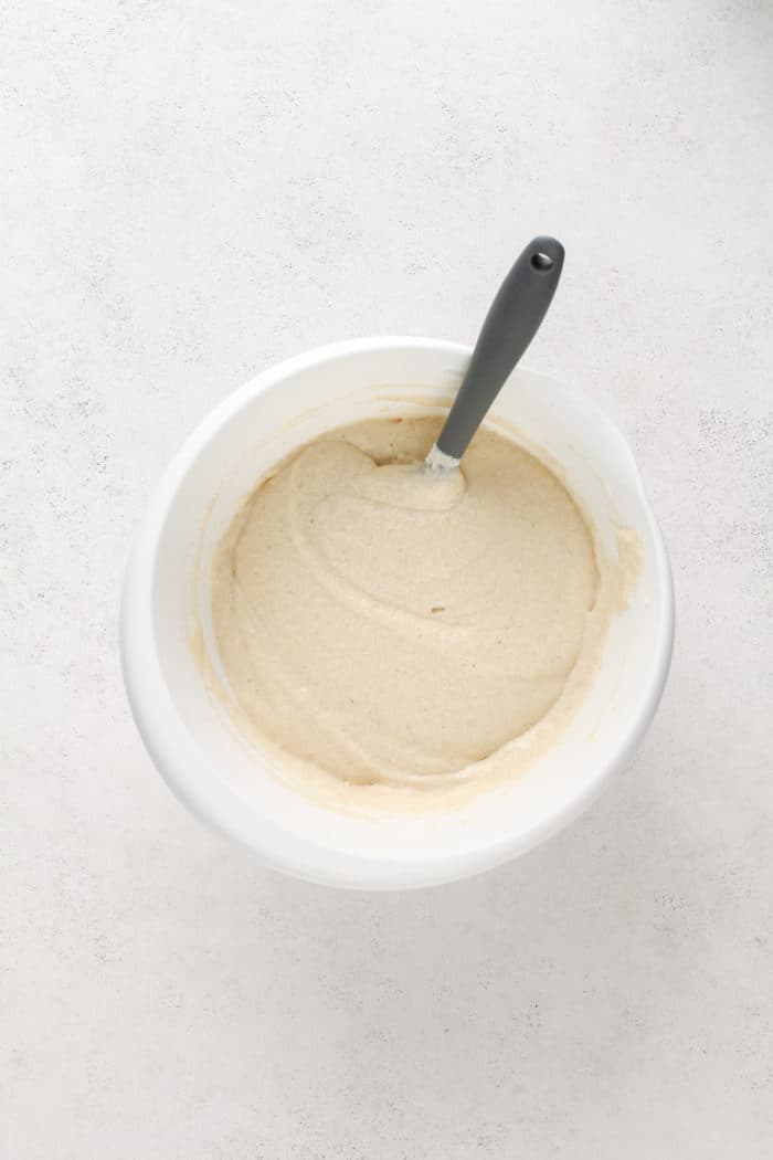 Vanilla cupcake batter in a white mixing bowl.