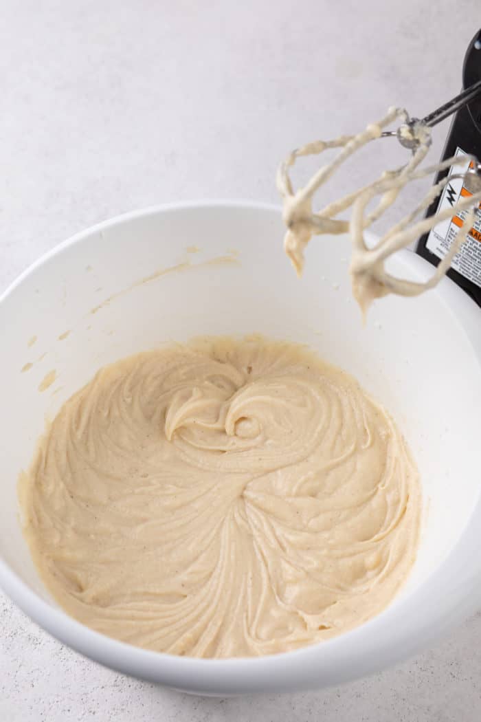 Base for vanilla cupcake batter in a white mixing bowl.
