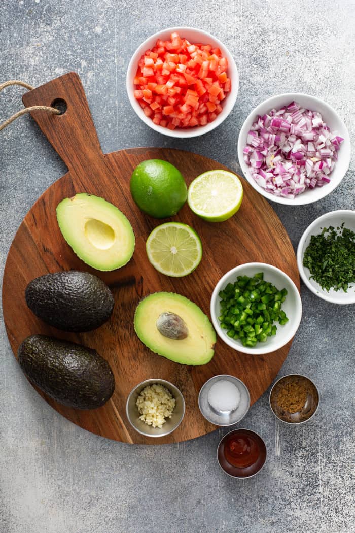 Ingredients for spicy guacamole arranged on a countertop