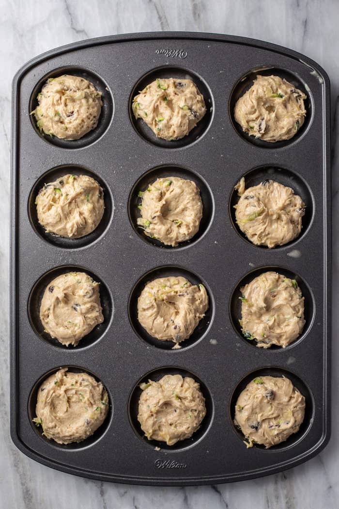 Zucchini cookie dough in a whoopie pie pan, ready to bake