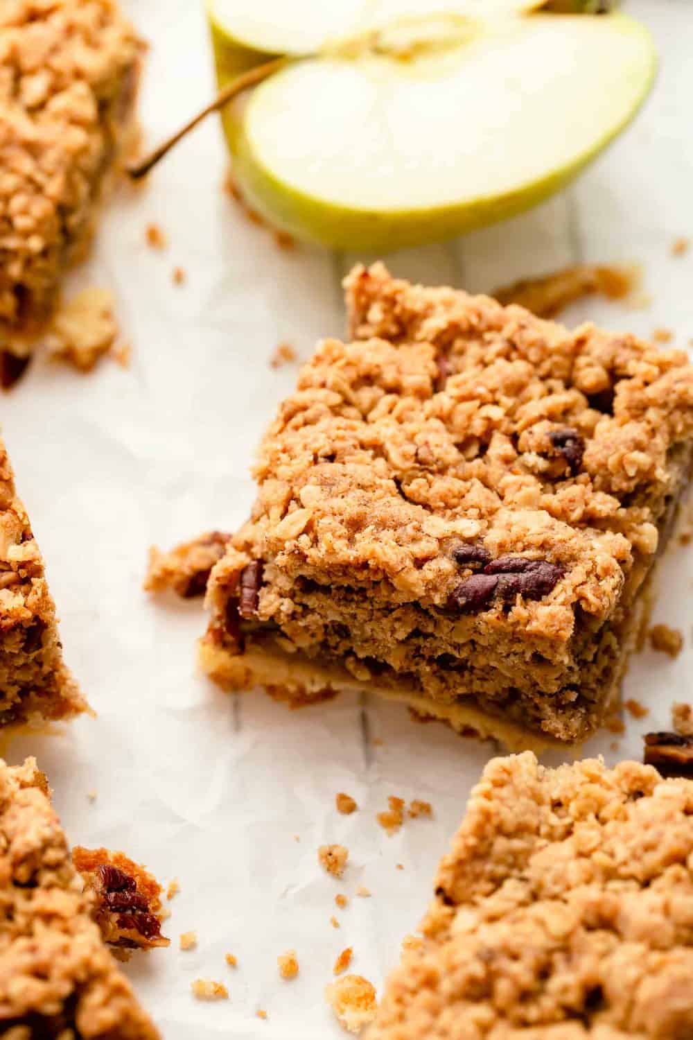 Close up of sliced apple pie bar with crumble topping