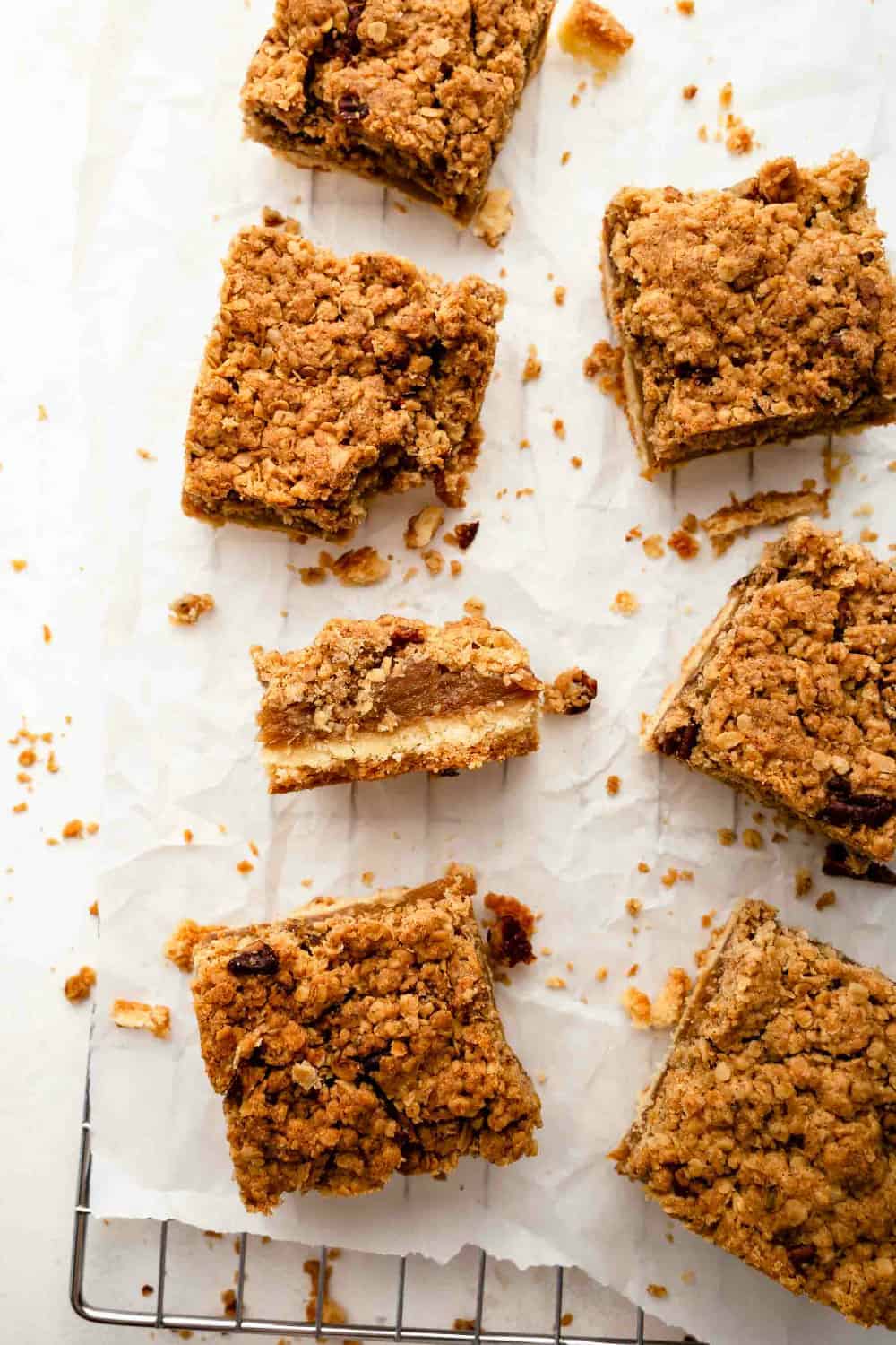 Sliced apple pie bars on parchment