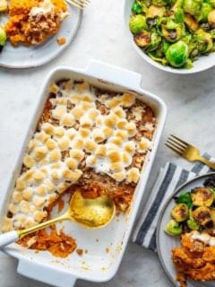 Sweet potato casserole with streusel topping in a white casserole dish
