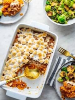 Sweet potato casserole with streusel topping in a white casserole dish