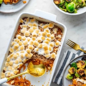 Sweet potato casserole with streusel topping in a white casserole dish